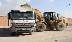 رفع التراكمات ومخلفات البناء والهدم بحي البساتين