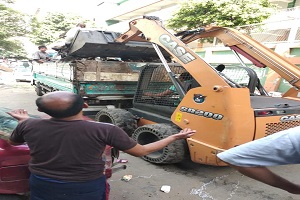 حملة للنظافة ورفع المخلفات برملة بولاق