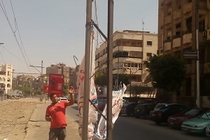 ازالة الاعلانات المخالفة بالحي