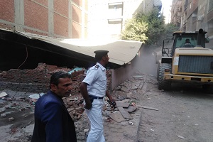 تنفيذ قرار أزاله على أرض أملاك الدولة بشارع عرابي