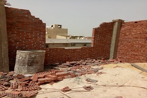 وقف بناء مخالف في البساتين ومصادرة طني أسمنت