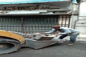 رفع كافة الحواجز المخالفة بالعديد من شوارع الحي