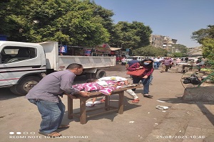 حملة لرفع اشغالات الكافيهات والمحلات بالحي